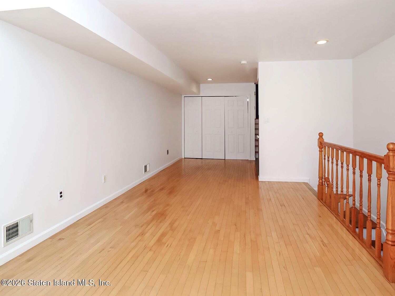 3438 A Amboy Road Staten Island, NY 10306 - Photo 6 of 21 a view of a room with wooden floor