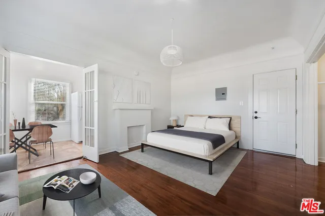 a spacious bedroom with a bed and furniture