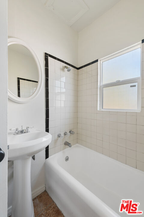 1044 North Bonnie Brae Street, Unit 202 Los Angeles, CA 90026 - Photo 5 of 6 a bathroom with a bathtub and a sink