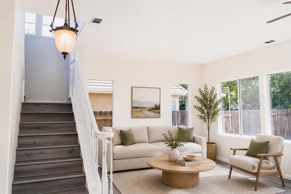 3005 Litt Road Modesto, CA 95355 - Photo 28 of 53 a living room with furniture and a chandelier