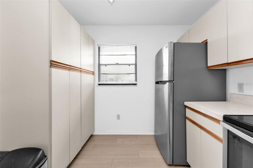 175 Kings Highway, Unit 723 Punta Gorda, FL 33983 - Photo 11 of 30 a kitchen with cabinets and stainless steel appliances