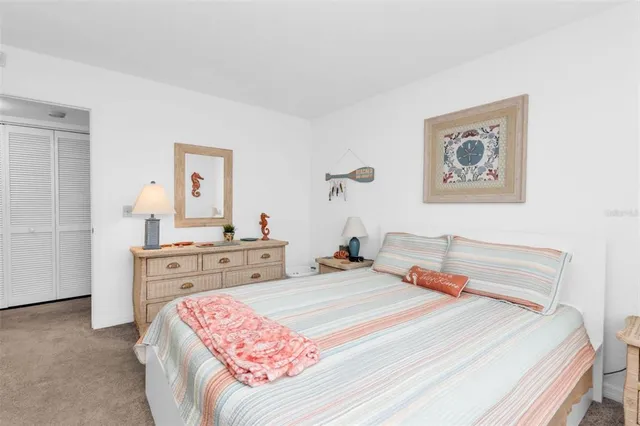 a bedroom with a bed and dresser