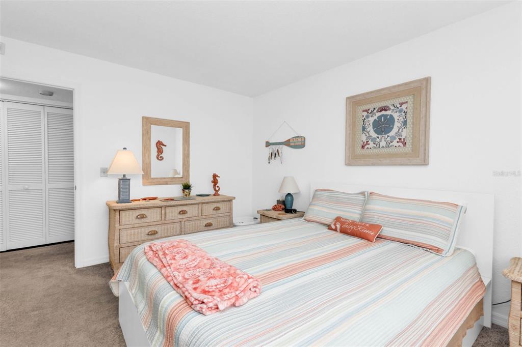 175 Kings Highway, Unit 723 Punta Gorda, FL 33983 - Photo 13 of 30 a bedroom with a bed and a dresser