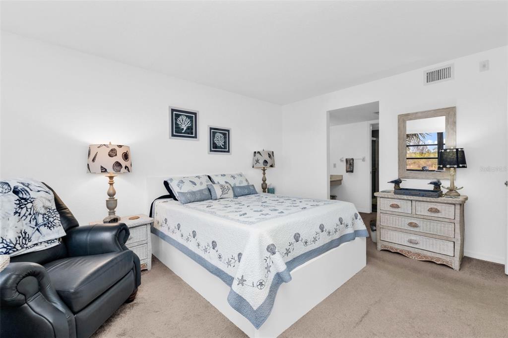 175 Kings Highway, Unit 723 Punta Gorda, FL 33983 - Photo 15 of 30 a bedroom with a bed and dresser