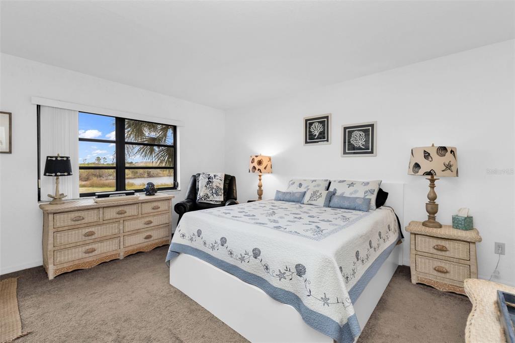 175 Kings Highway, Unit 723 Punta Gorda, FL 33983 - Photo 16 of 30 a spacious bedroom with a bed and a dresser