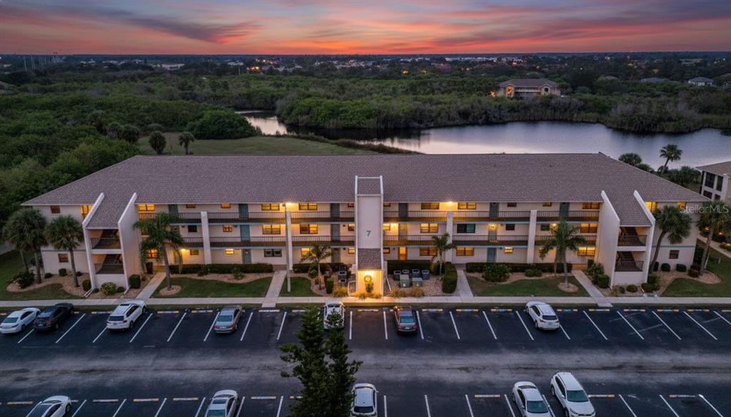 175 Kings Highway, Unit 723 Punta Gorda, FL 33983 - Photo 2 of 30 a view of a patio with table and chairs and potted plants