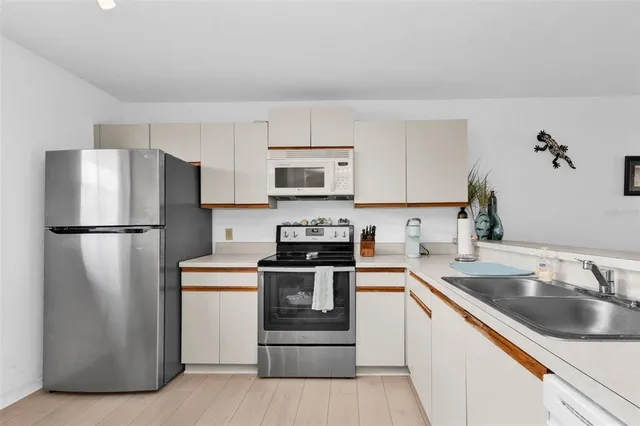 a bathroom with a sink toilet tub and shower
