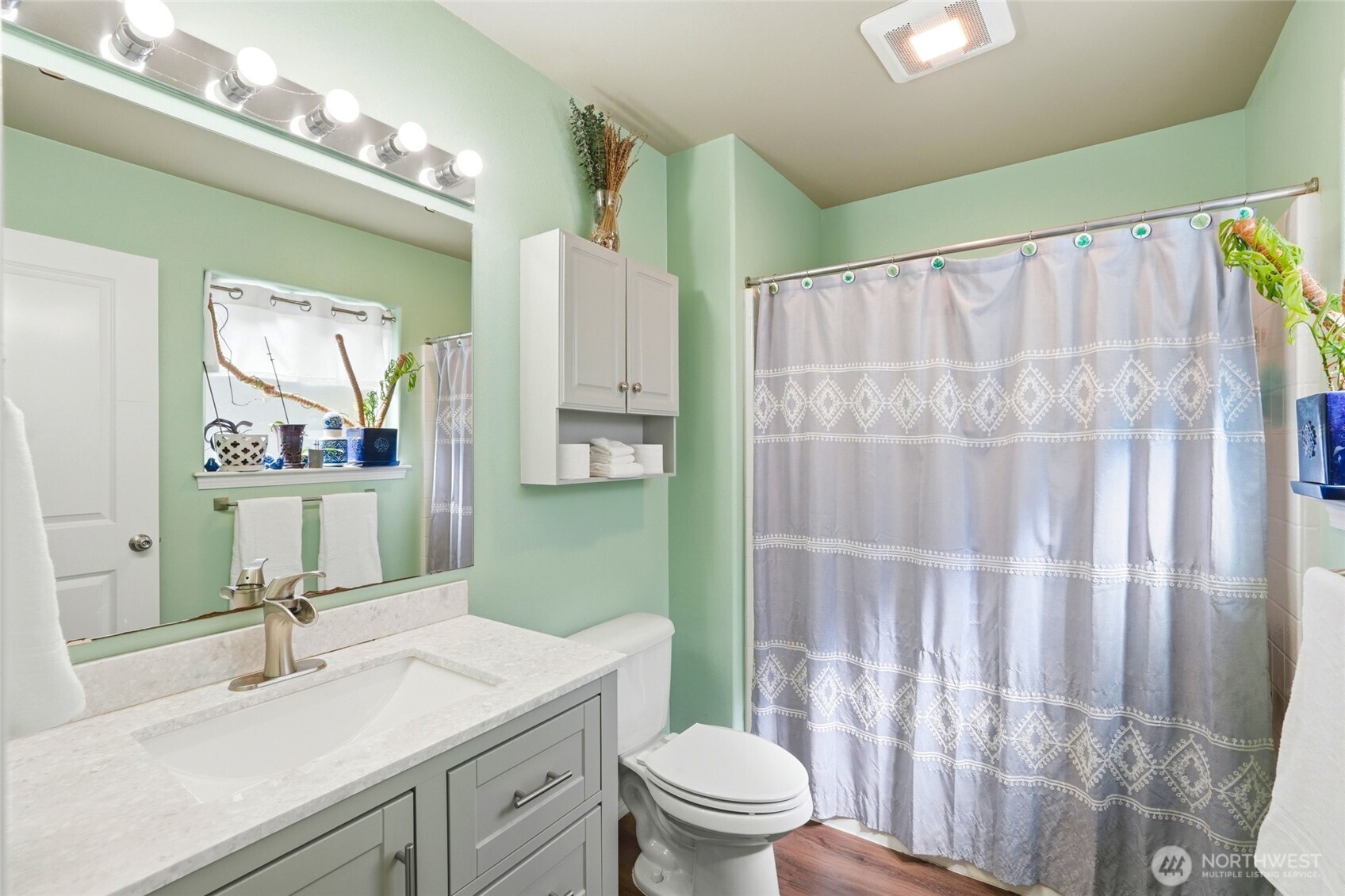 310 Jeff Street Mount Vernon, WA 98274 - Photo 20 of 35 a bathroom with a sink a toilet a mirror a vanity and shower