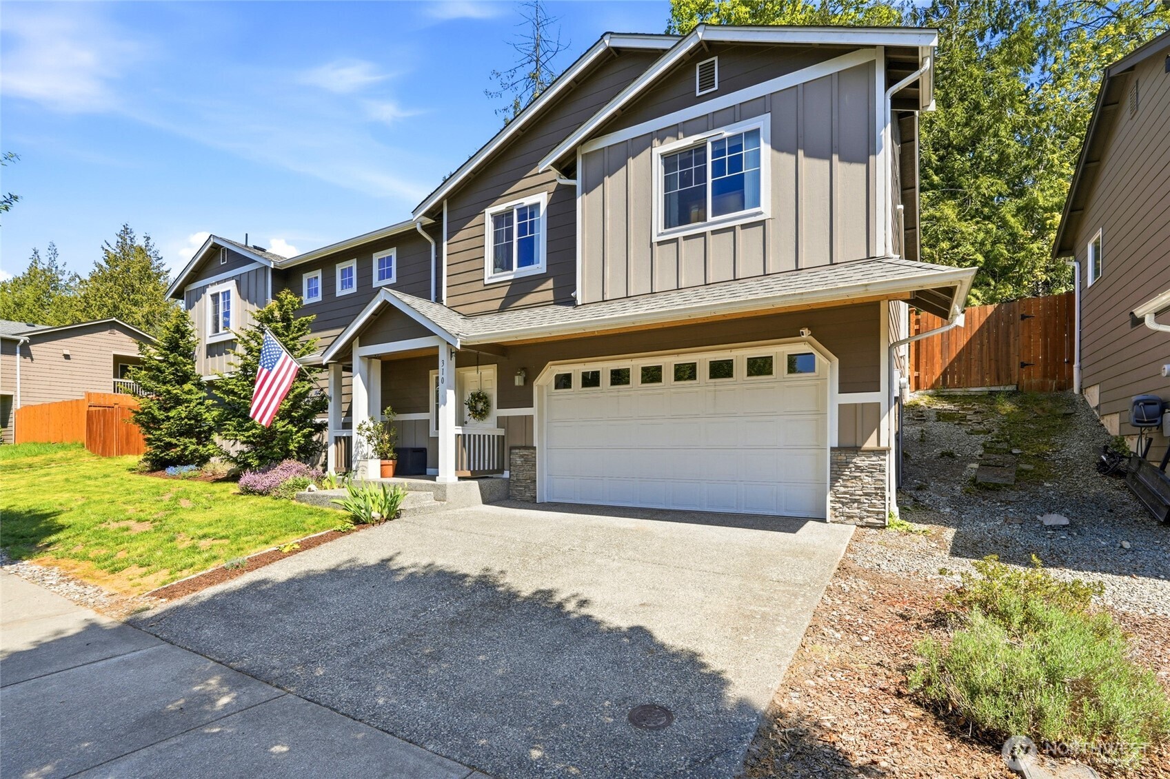 310 Jeff Street Mount Vernon, WA 98274 - Photo 6 of 35 a front view of a house with a yard and garage