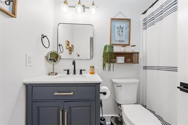 a bedroom with furniture and a window