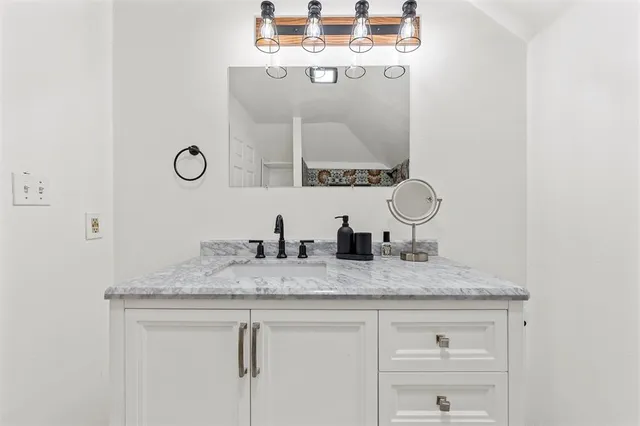a bathroom with a bathtub and shower
