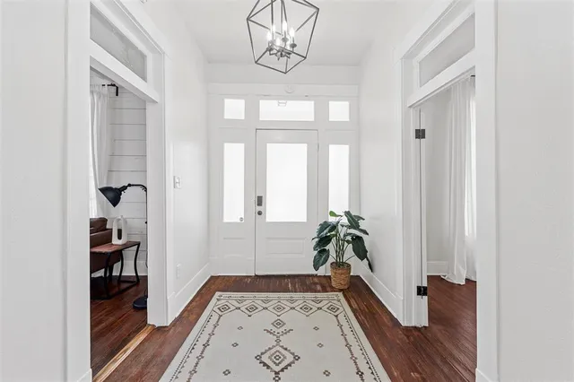 a view of front door with wooden floor