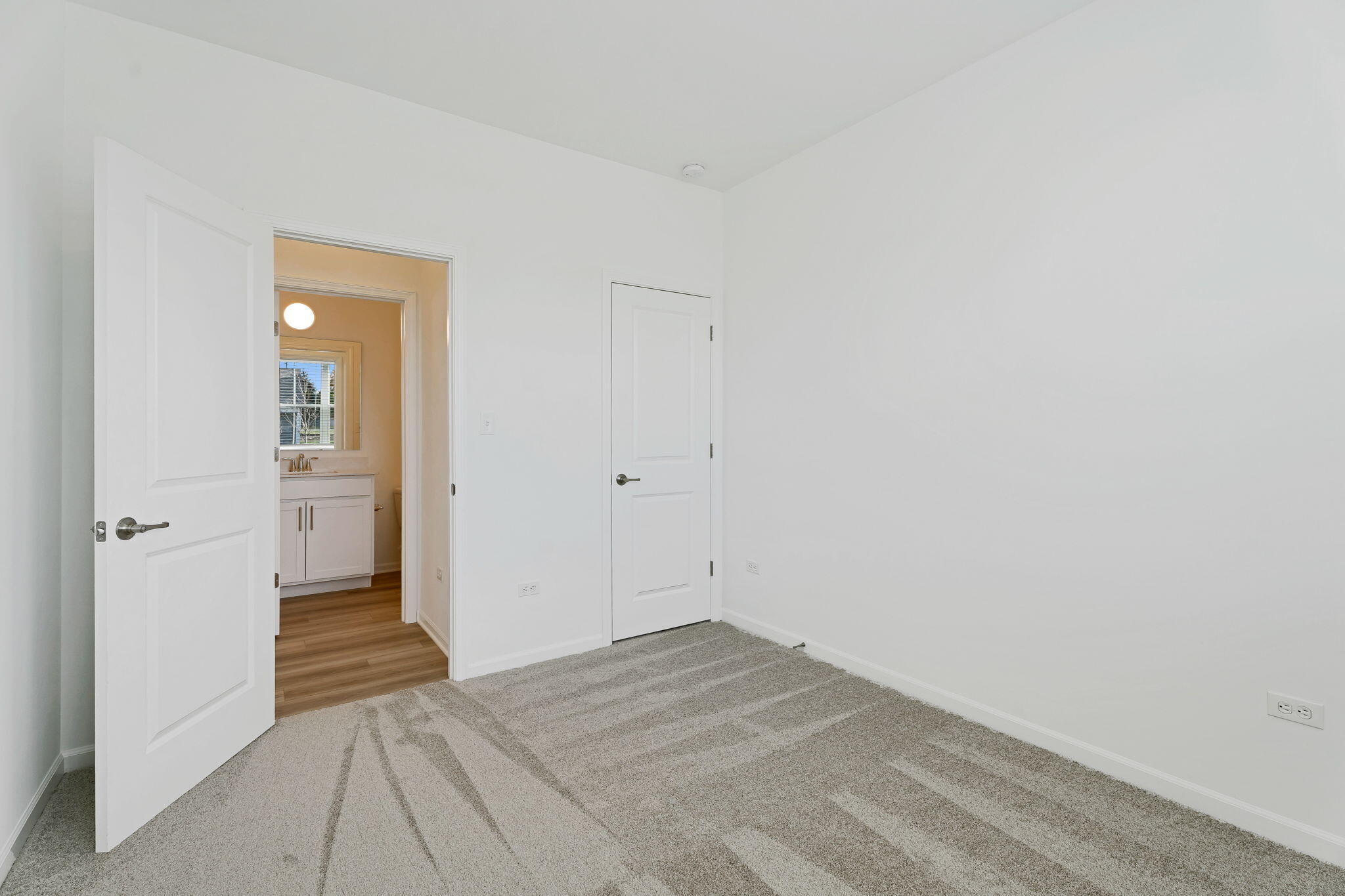 481 East 127th Lane Crown Point, IN 46307 - Photo 11 of 29 a view of a room with wooden floor and a bathroom