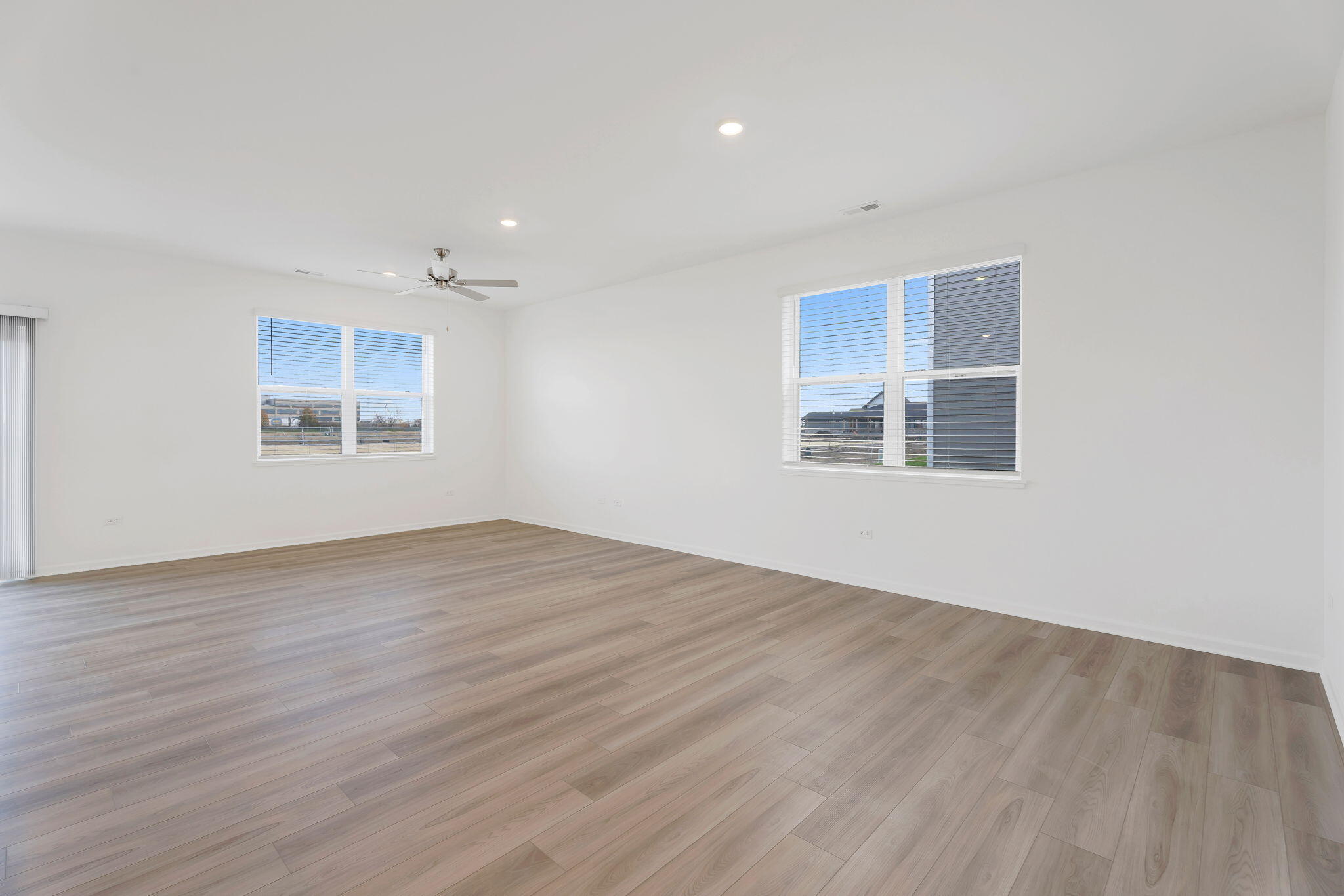 481 East 127th Lane Crown Point, IN 46307 - Photo 17 of 29 a view of an empty room with wooden floor and a window