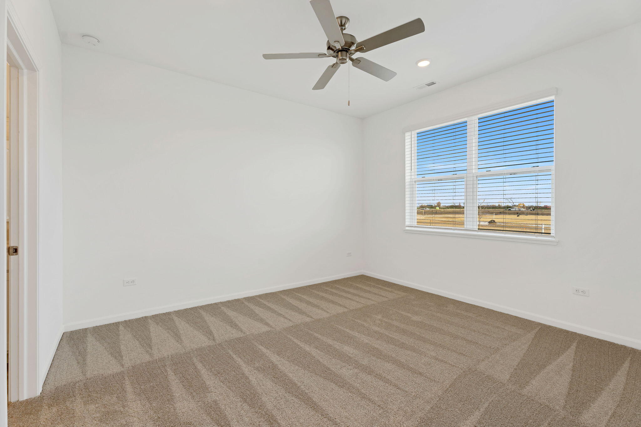 481 East 127th Lane Crown Point, IN 46307 - Photo 18 of 29 an empty room with windows and fan