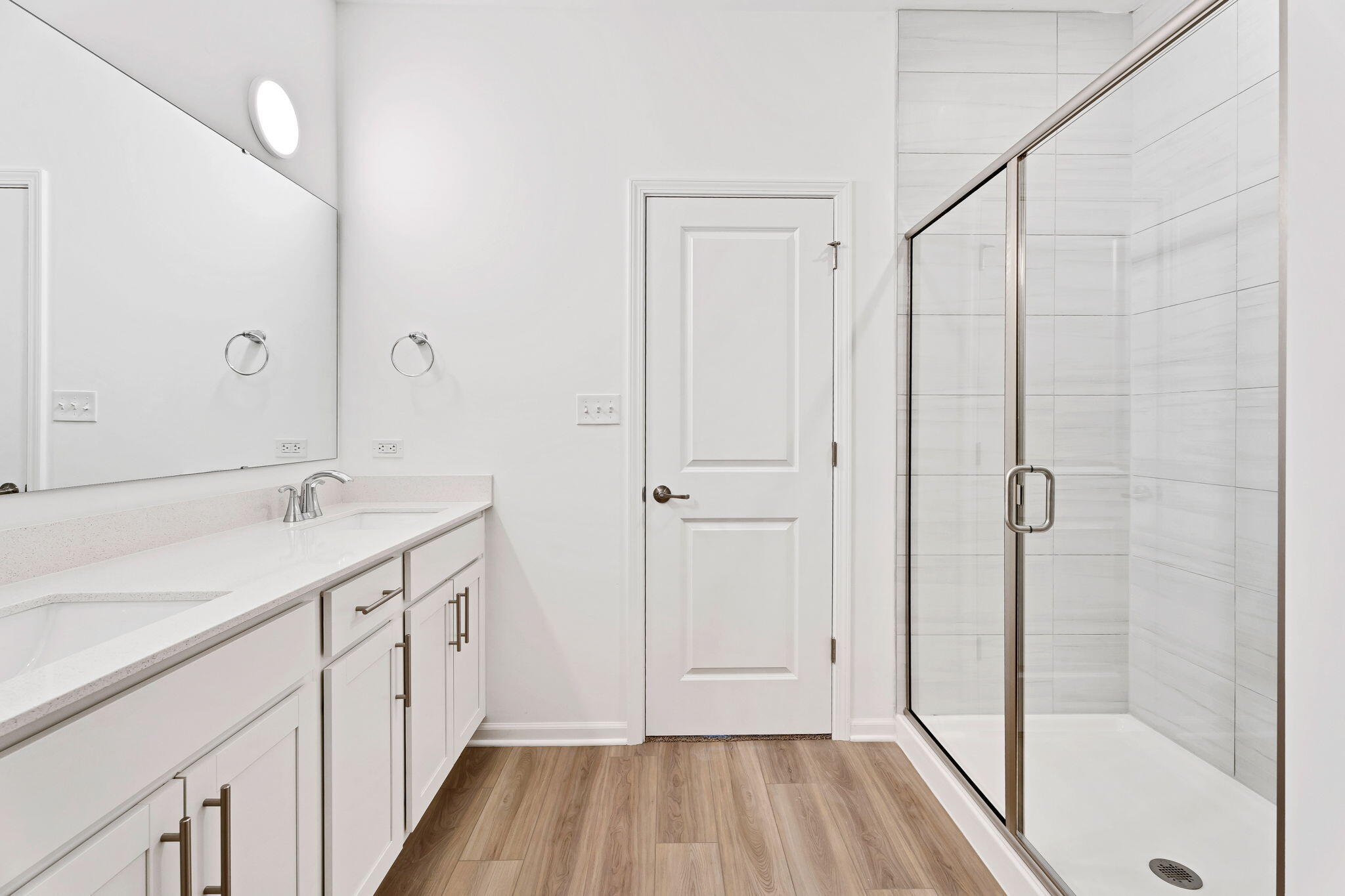 481 East 127th Lane Crown Point, IN 46307 - Photo 23 of 29 a bathroom with a sink a mirror and a shower