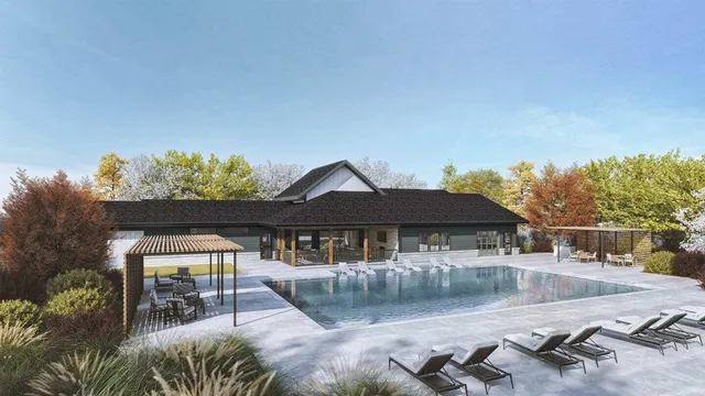 a backyard of a house with table and chairs