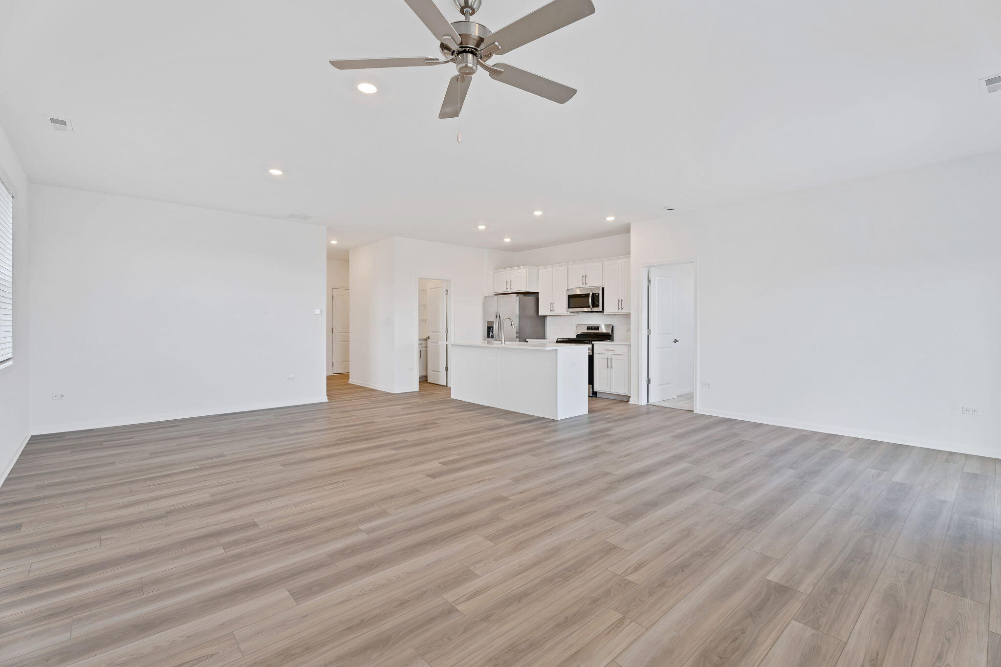 481 East 127th Lane Crown Point, IN 46307 - Photo 9 of 29 a view of a kitchen with a sink and a stove top oven