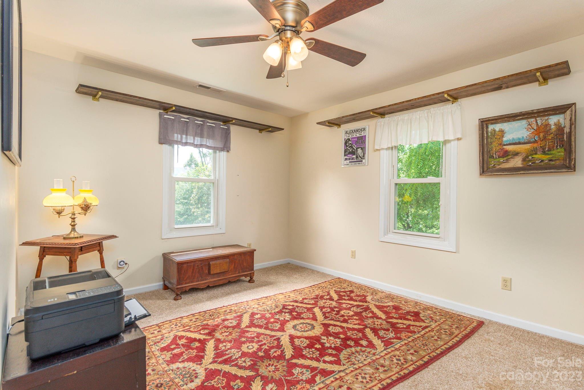64 Israel Road Canton, NC 28716 - Photo 13 of 22 a living room with furniture and a rug