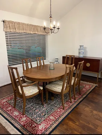 a bedroom with a bed and curtain