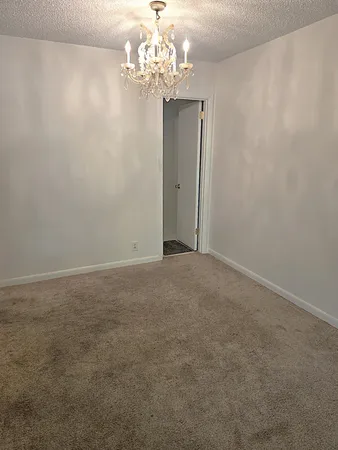 a view of a chandelier in big room