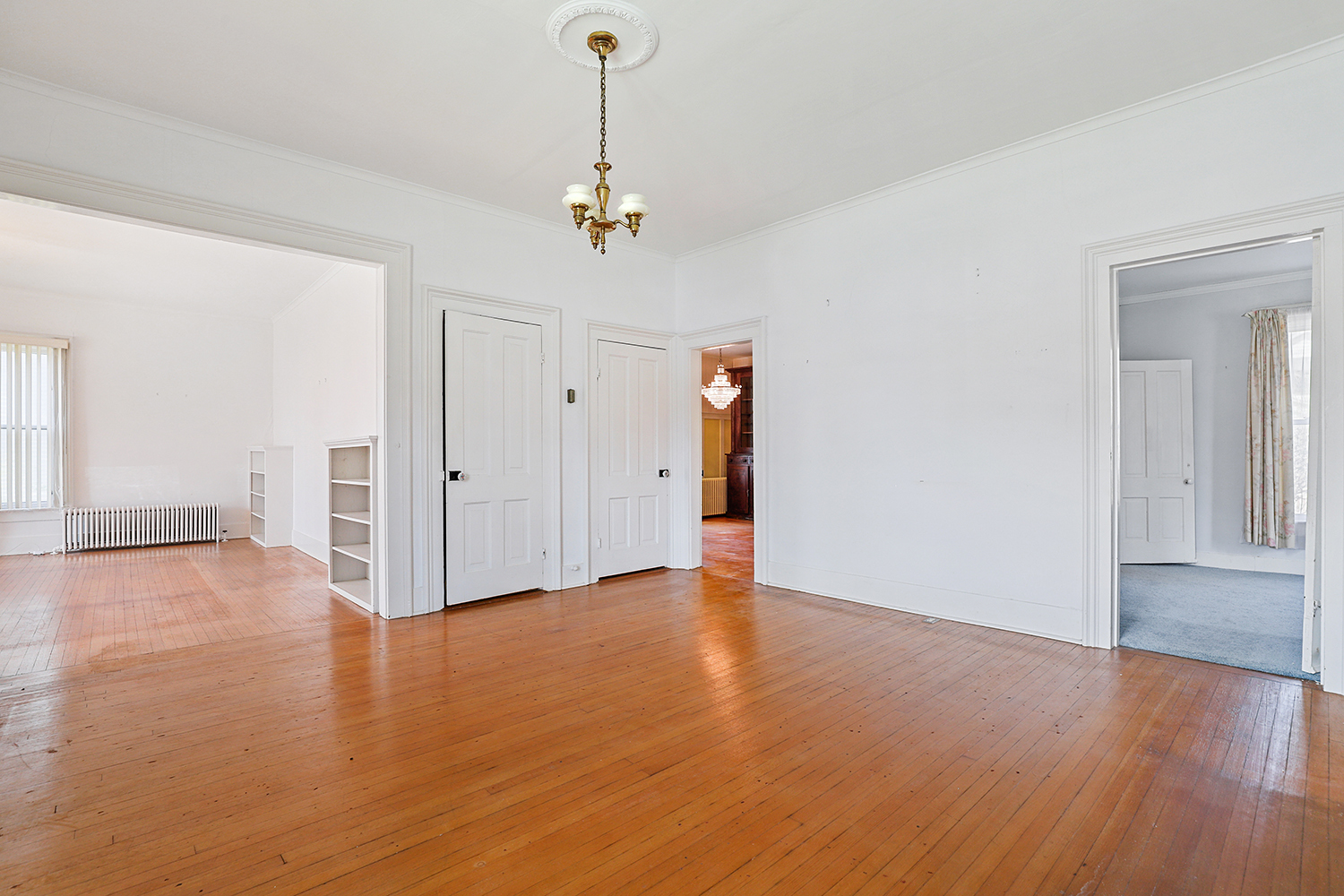 309 East 3rd Street Sandwich, IL 60548 - Photo 9 of 33 a view of a room with wooden floor and carpet