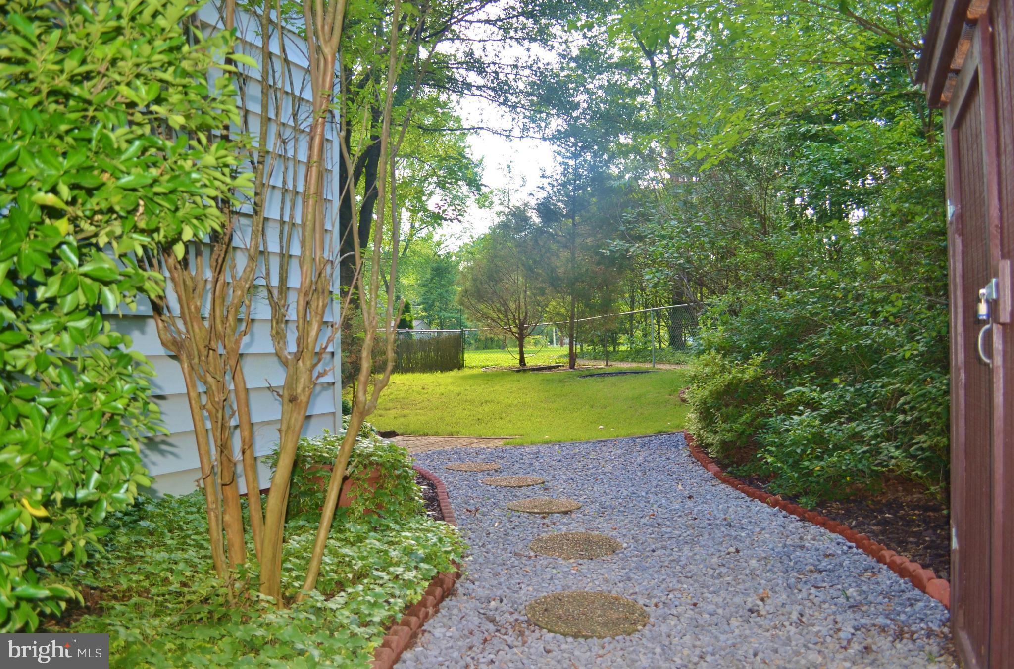 18 Ridge Road, Unit E Greenbelt, MD 20770 - Photo 13 of 15 Side Yard Walkway