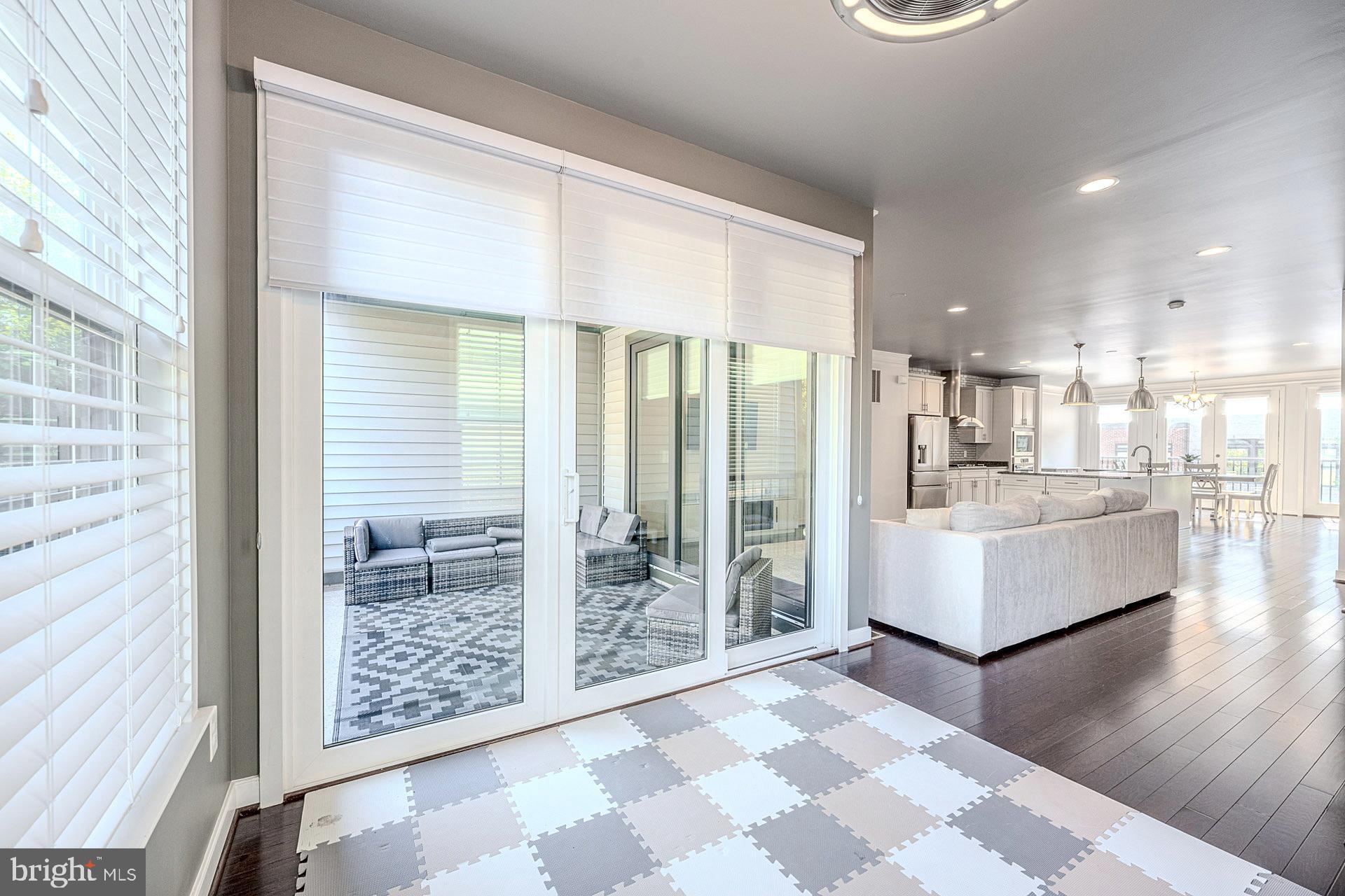 42298 Impervious Terrace Brambleton, VA 20148 - Photo 16 of 39 a large living room with a large window