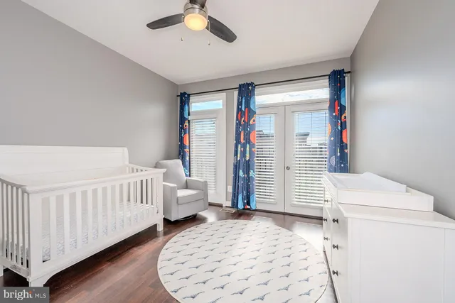 a bedroom with furniture and white walls