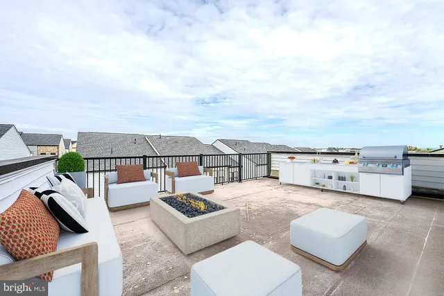 an outdoor living room with furniture and a couch