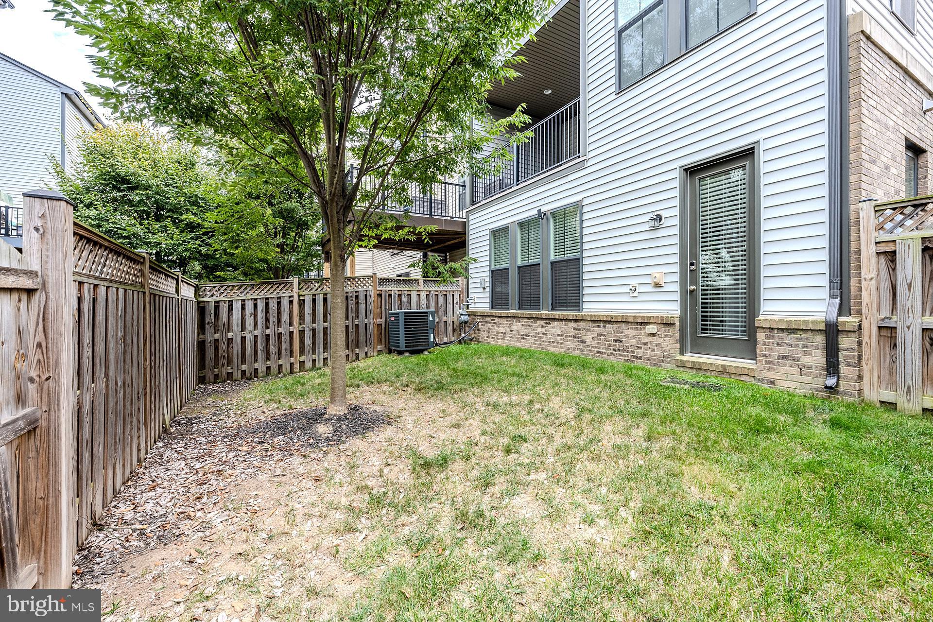 42298 Impervious Terrace Brambleton, VA 20148 - Photo 38 of 39 a white house that has tree in front of it