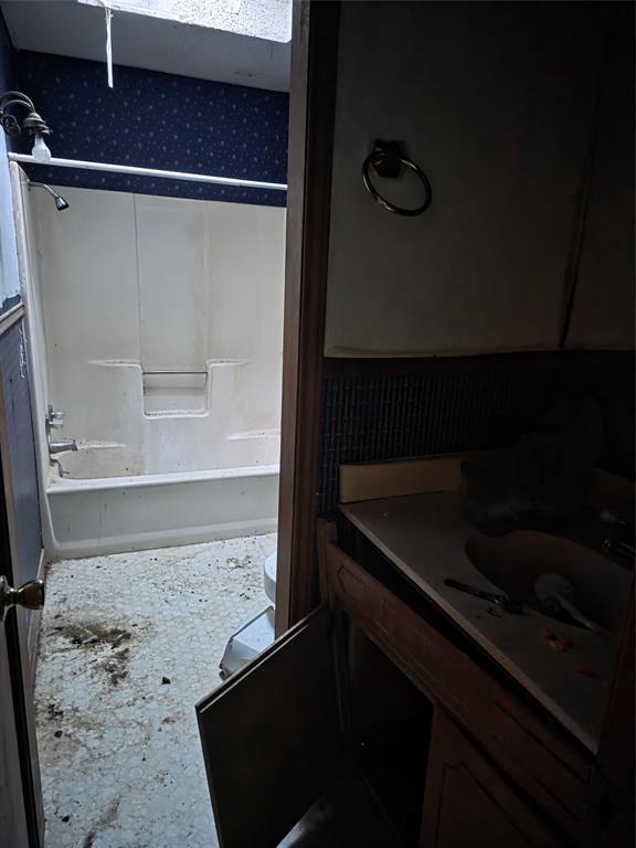 7442 County Road 4812 Commerce, TX 75428 - Photo 12 of 15 Bathroom featuring vanity and shower / tub combination