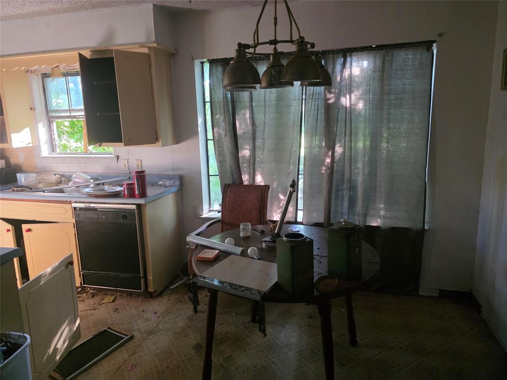 7442 County Road 4812 Commerce, TX 75428 - Photo 4 of 15 Dining area featuring a textured ceiling