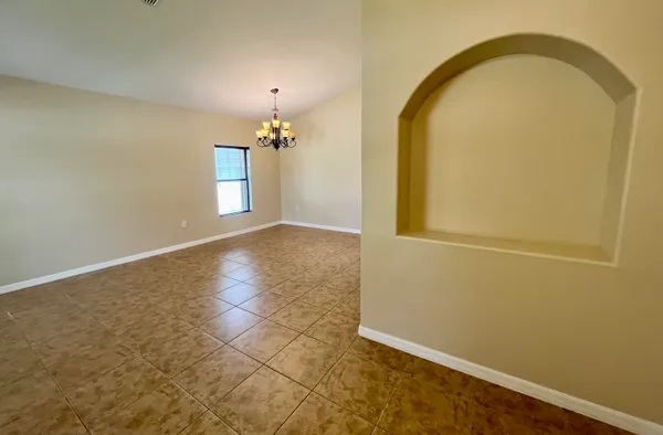 a kitchen with stainless steel appliances granite countertop a refrigerator a stove a sink a microwave and cabinets