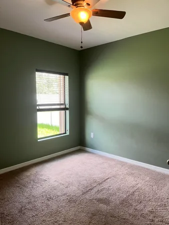 a view of a storage & utility room with dryer and washer