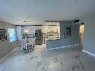2032 Guildford East, Unit 2032B Boca Raton, FL 33434 - Photo 7 of 14 Living Room Dining Room Kitchen