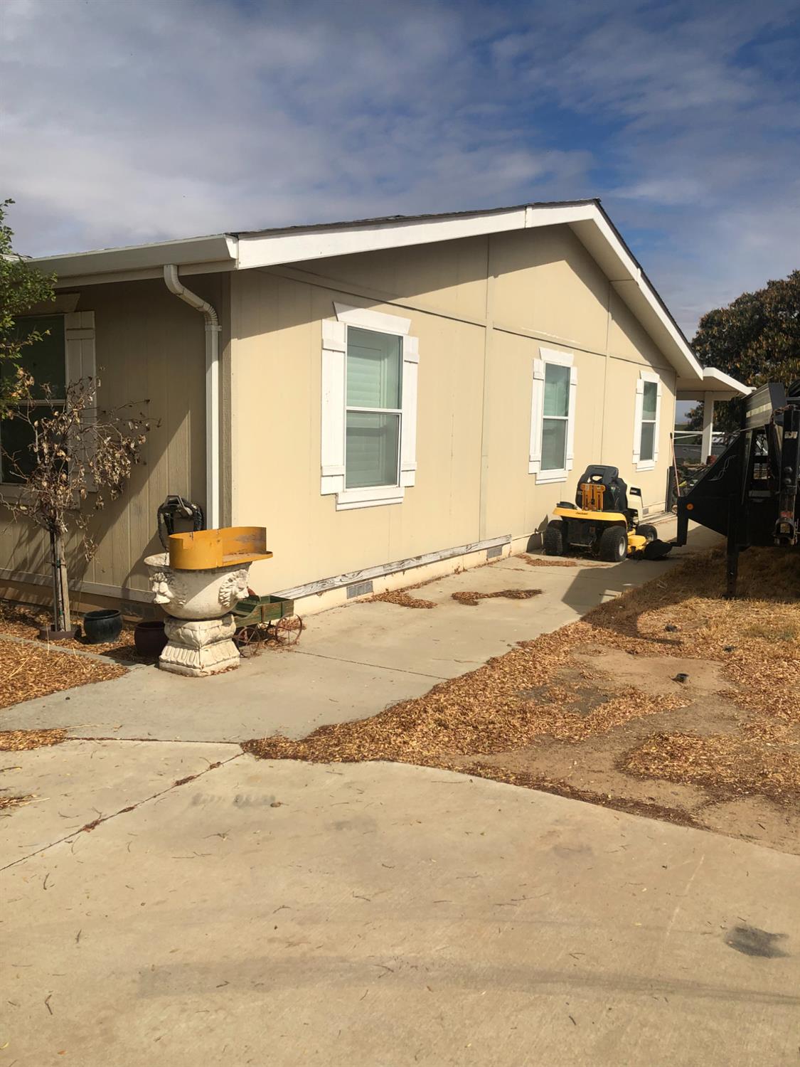1313 South Stearns Road Oakdale, CA 95361 - Photo 19 of 57 a front view of a house with a yard