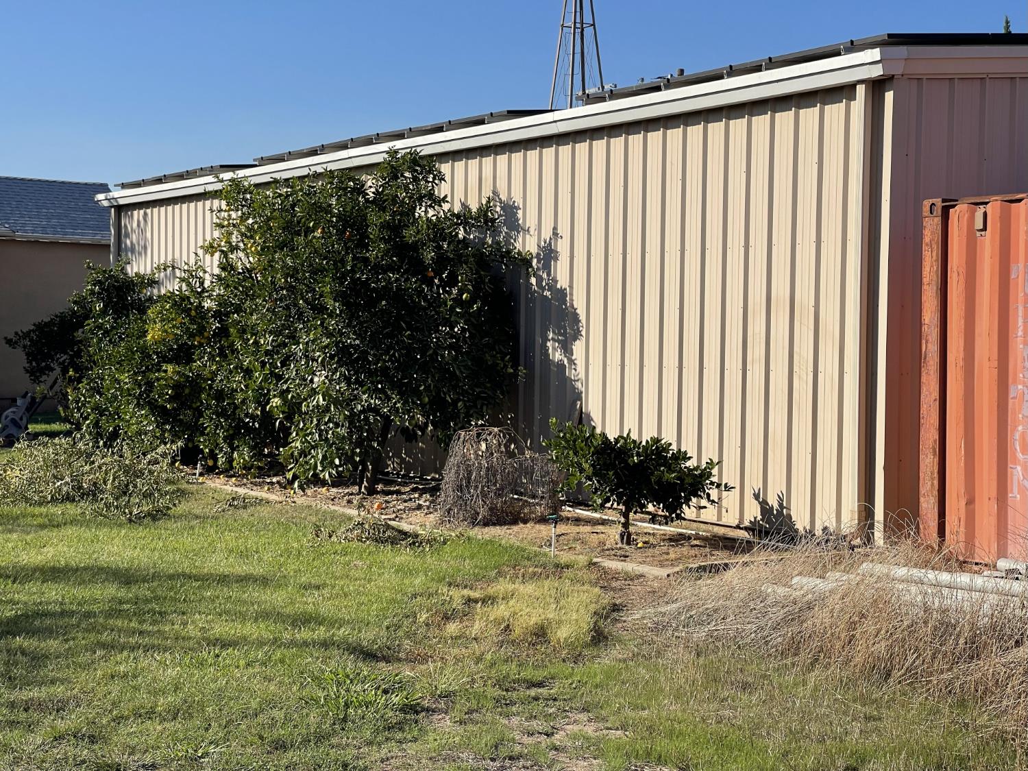 1313 South Stearns Road Oakdale, CA 95361 - Photo 49 of 57 a view of a house with a yard and plants