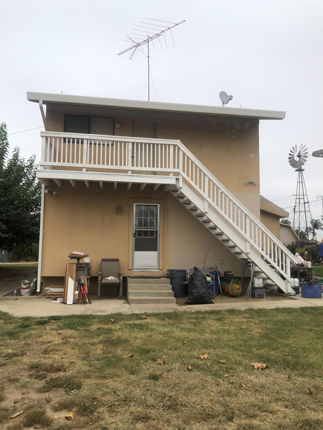 1313 South Stearns Road Oakdale, CA 95361 - Photo 7 of 57 a view of a big house with a balcony