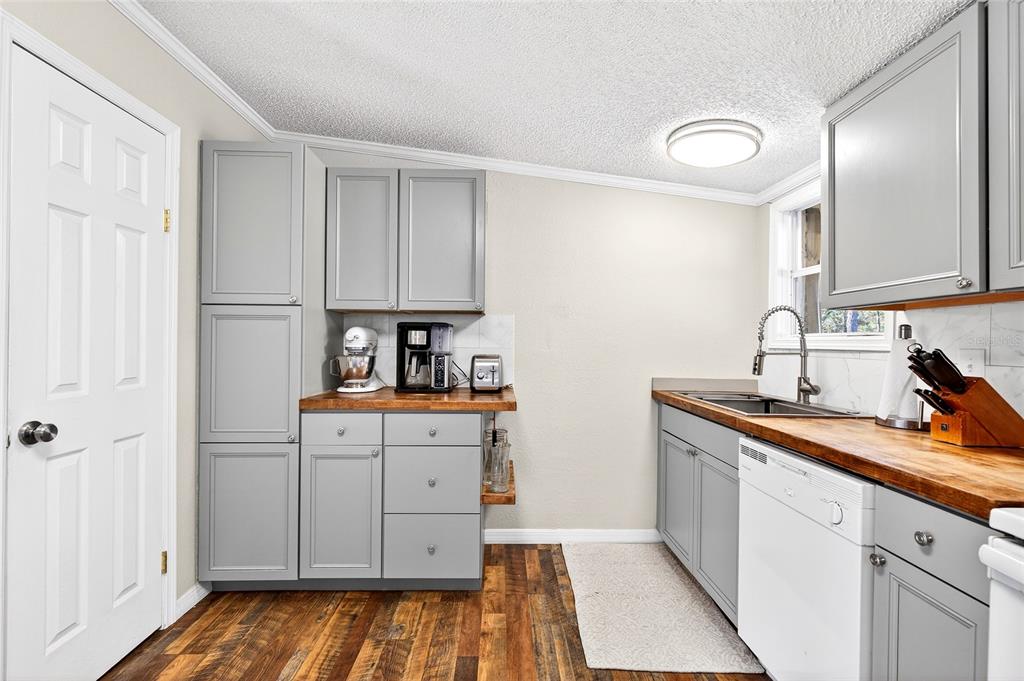 17087 Southwest 27 Street Dunnellon, FL 34432 - Photo 13 of 53 a kitchen with sink cabinets and stove