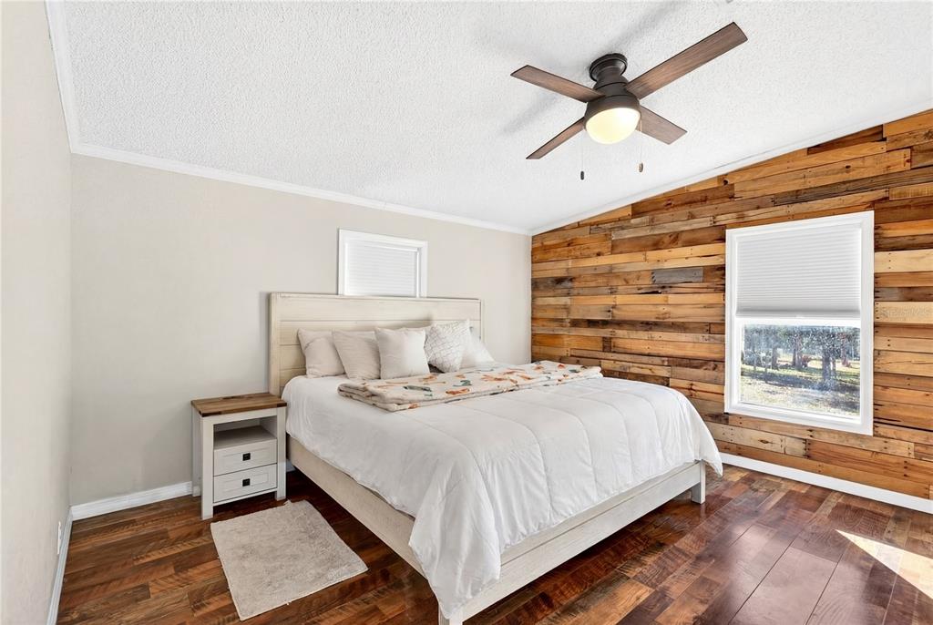 17087 Southwest 27 Street Dunnellon, FL 34432 - Photo 15 of 53 a bedroom with a bed and a large window