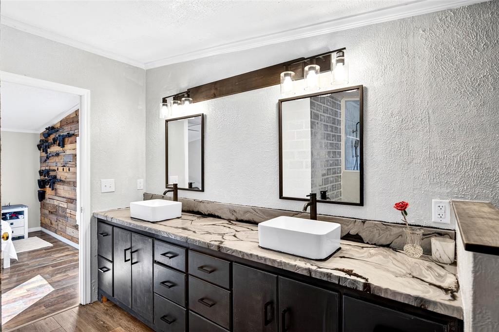 17087 Southwest 27 Street Dunnellon, FL 34432 - Photo 18 of 53 a bathroom with a granite countertop sink and a mirror