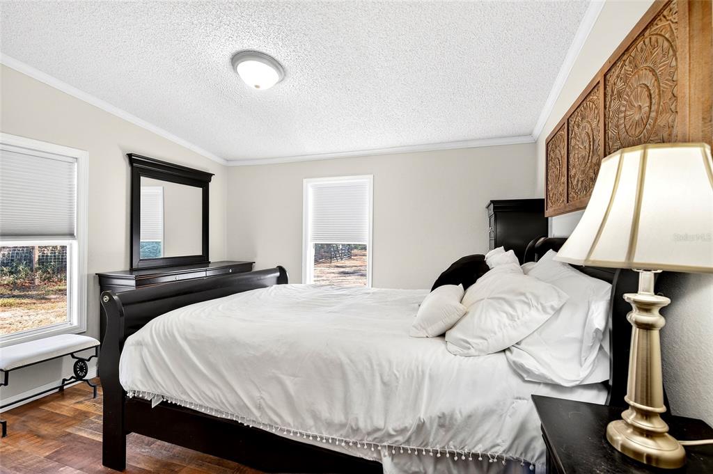 17087 Southwest 27 Street Dunnellon, FL 34432 - Photo 22 of 53 a bedroom with a bed and window