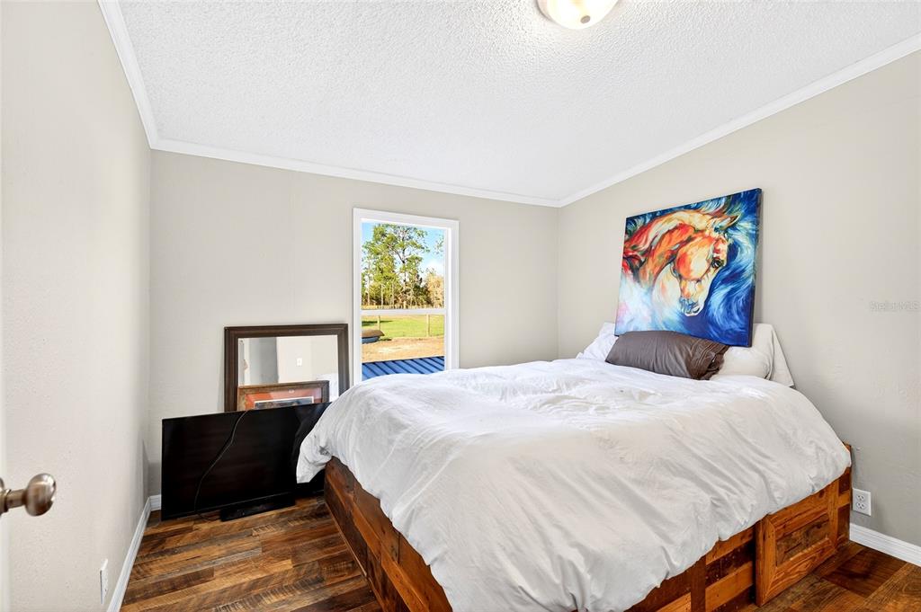 17087 Southwest 27 Street Dunnellon, FL 34432 - Photo 24 of 53 a bedroom with a bed and a window