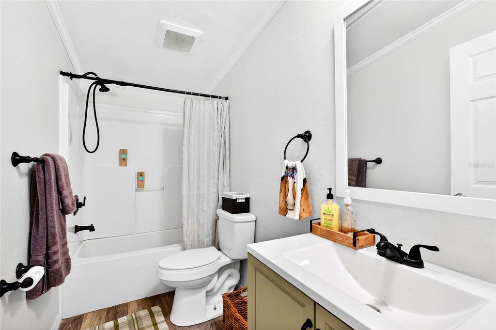 17087 Southwest 27 Street Dunnellon, FL 34432 - Photo 25 of 53 a bathroom with a sink toilet and shower