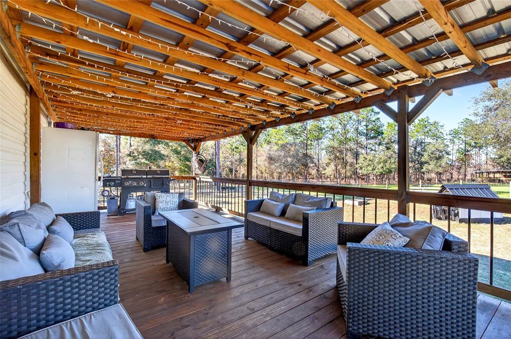 17087 Southwest 27 Street Dunnellon, FL 34432 - Photo 28 of 53 a living room with furniture a wooden floor and a sink