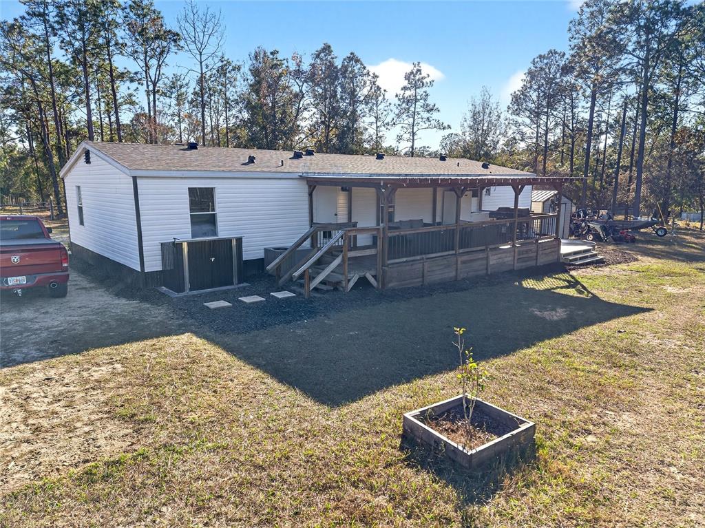 17087 Southwest 27 Street Dunnellon, FL 34432 - Photo 33 of 53 a view of a backyard with a patio
