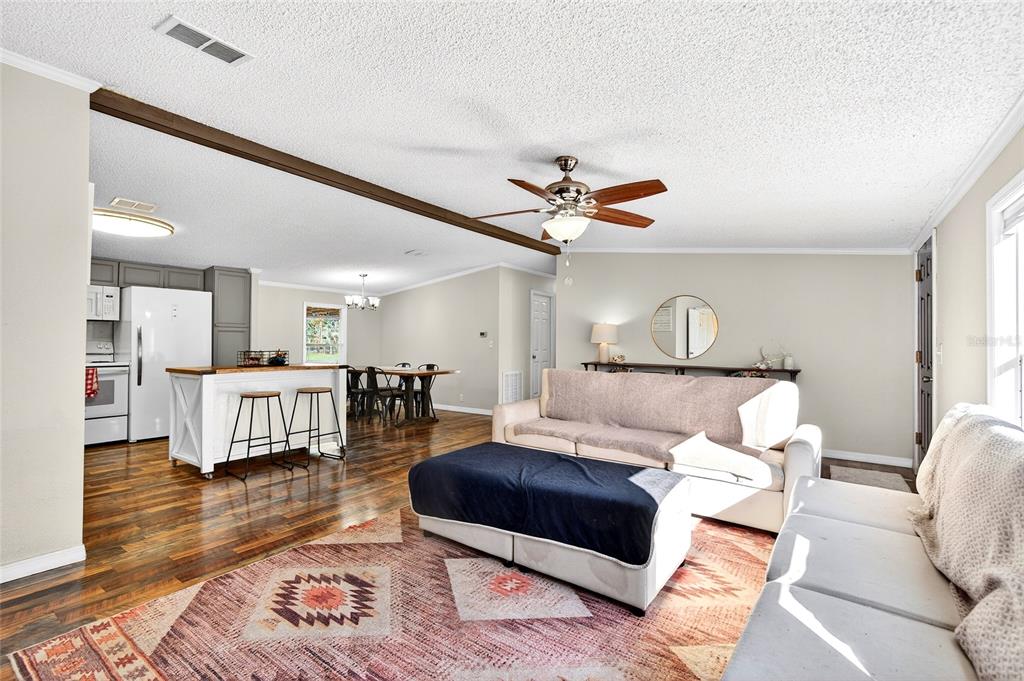 17087 Southwest 27 Street Dunnellon, FL 34432 - Photo 4 of 53 a living room with furniture and a wooden floor