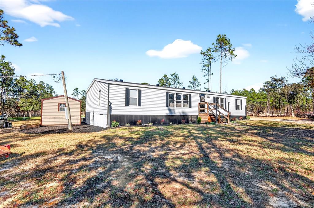 17087 Southwest 27 Street Dunnellon, FL 34432 - Photo 49 of 53 a view of a house with a patio