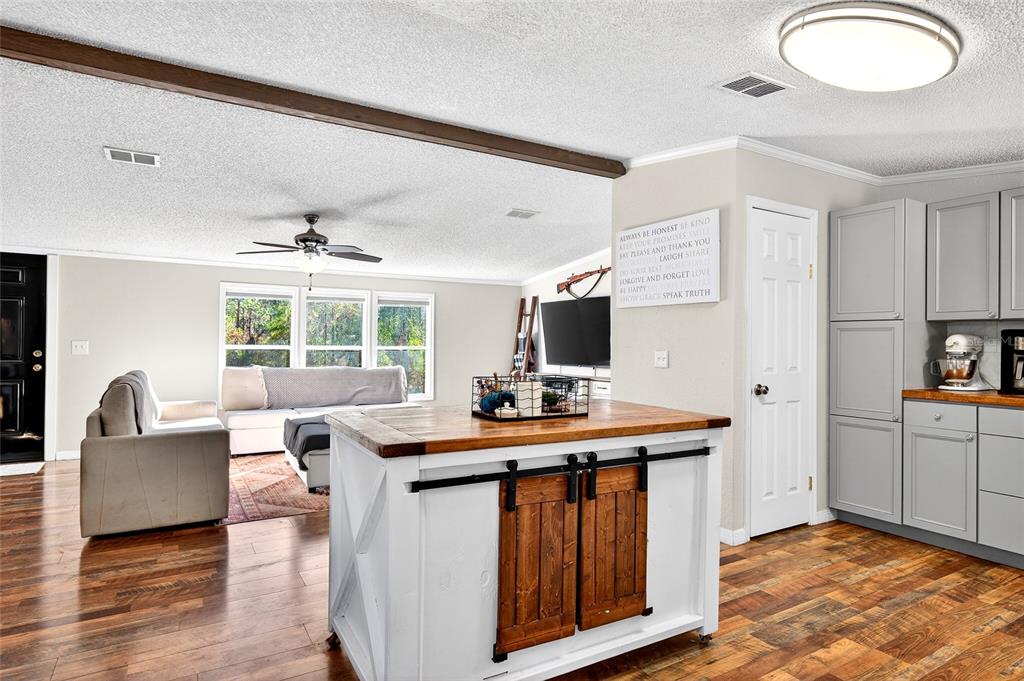 17087 Southwest 27 Street Dunnellon, FL 34432 - Photo 9 of 53 a view of a kitchen area with furniture and a window